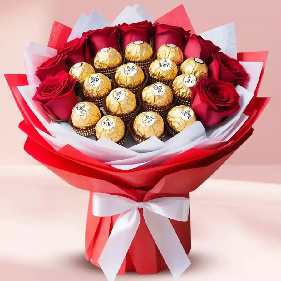Premium bouquet featuring red roses and Ferrero Rocher chocolates, elegantly wrapped in tissue.