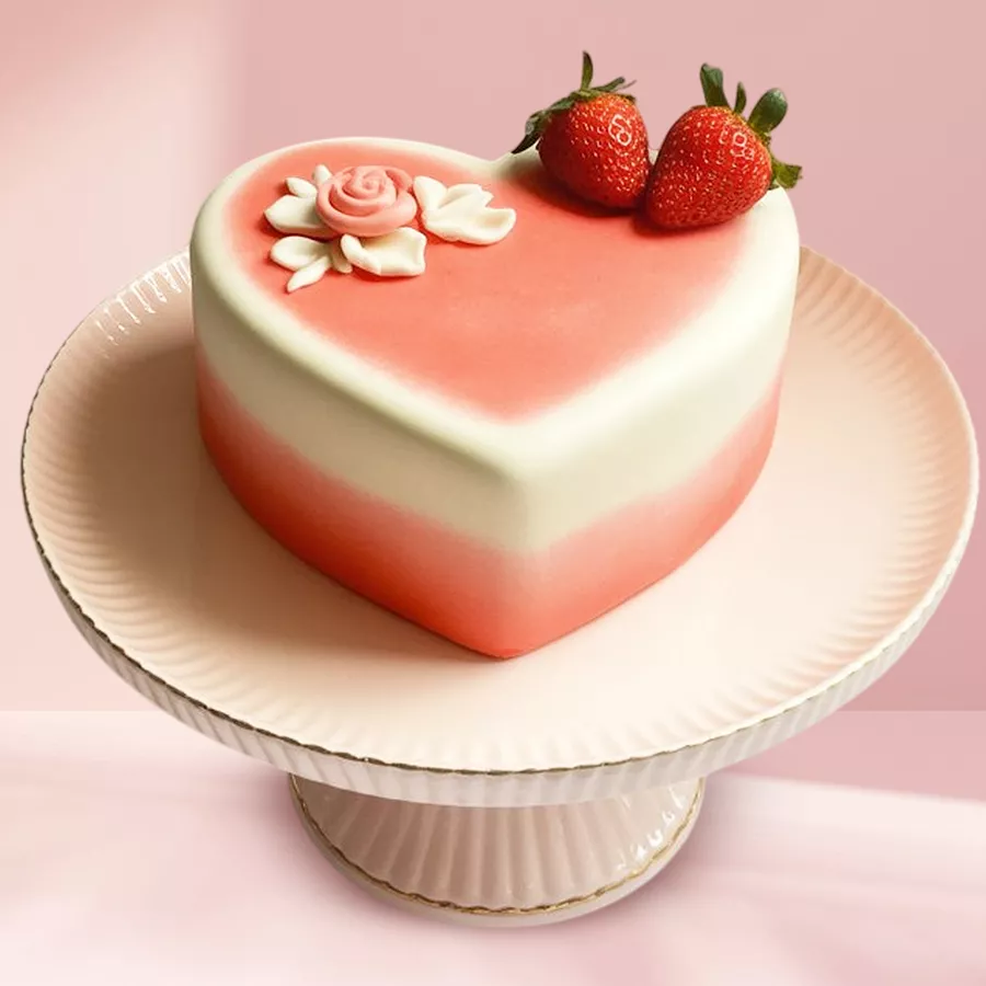 Heart-shaped strawberry fondant cake, ideal for expressing love and celebration.