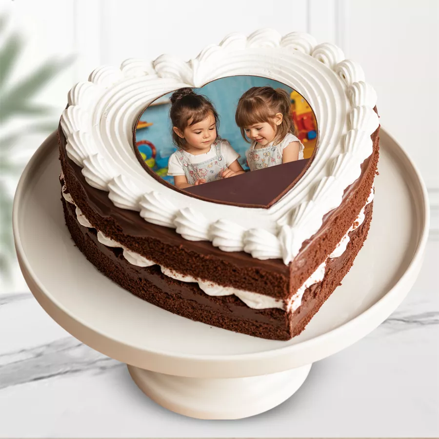 Heart-shaped chocolate photo cake with personalized photo topping and rich chocolate icing.