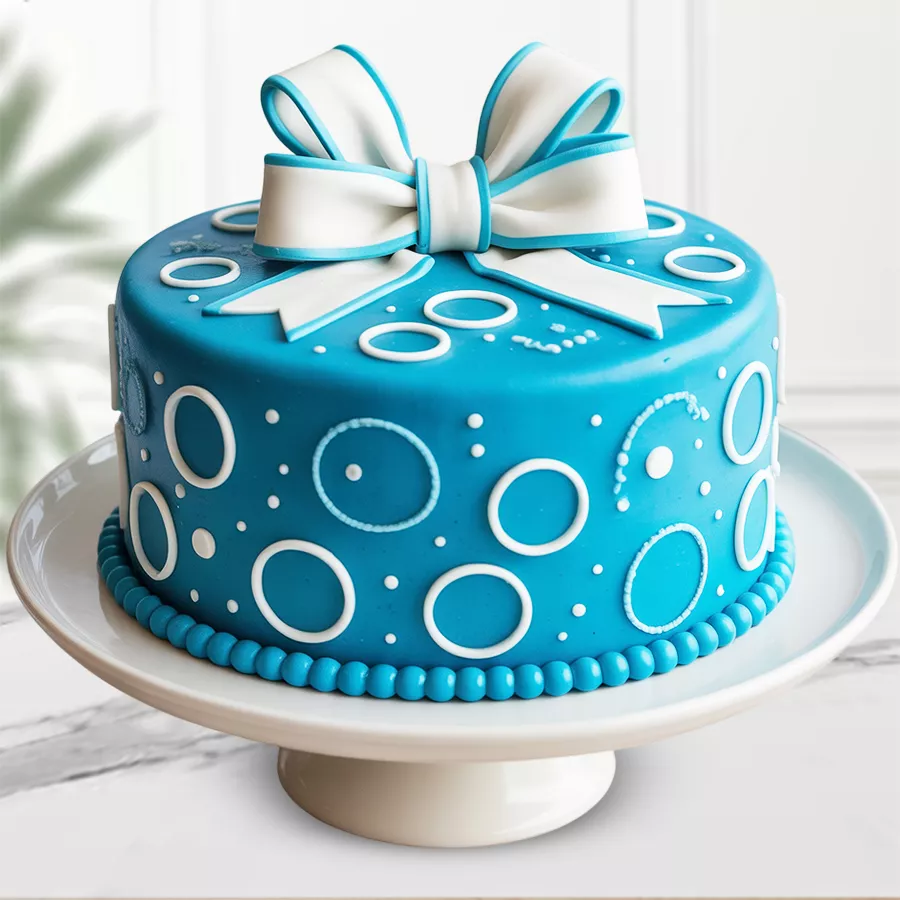 Luscious eggless butterscotch cake with a blue fondant bow tie.