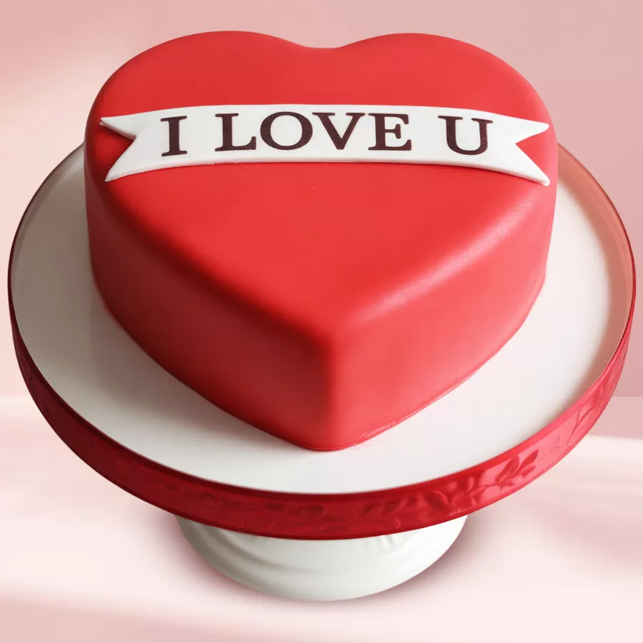 Heartfelt Fondant Cake of Love with a sponge base and red fondant ribbon.