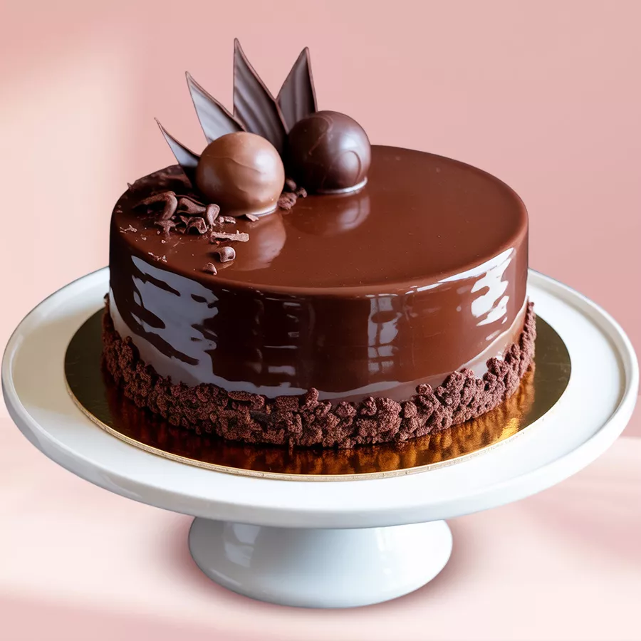 A round Eggless Chocolate Truffle Cake with chocolate glaze icing and a chocolaty design, weighing 3 kg.