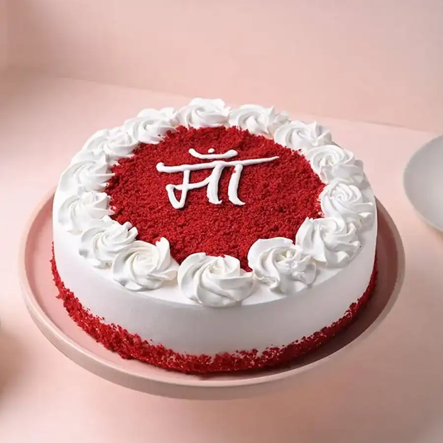 Scrumptious 1/2 Kg round red velvet cake with "MAA" written in Hindi, perfect for Mother's Day.