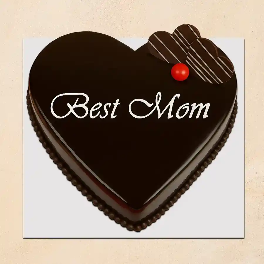 Heart-shaped vanilla cake for Mother's Day with "Best Mom" message.