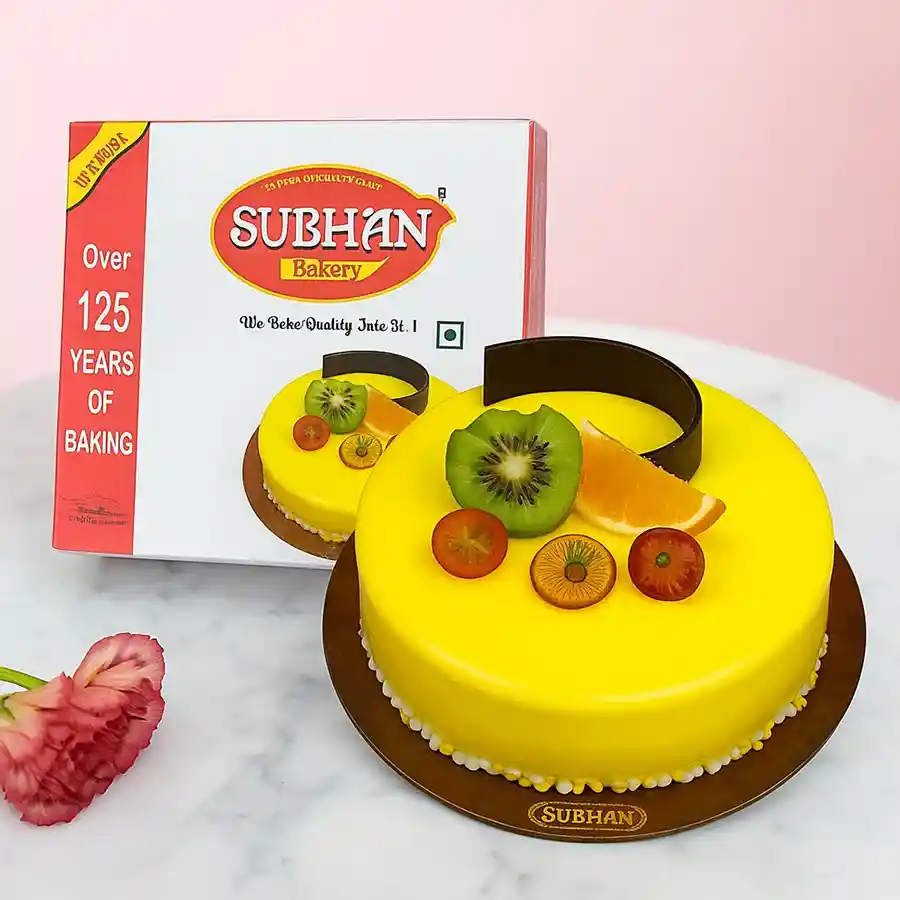 Tropical Bliss Pineapple Cake from Subhan Bakery, adorned with pineapple slices and coconut flakes.