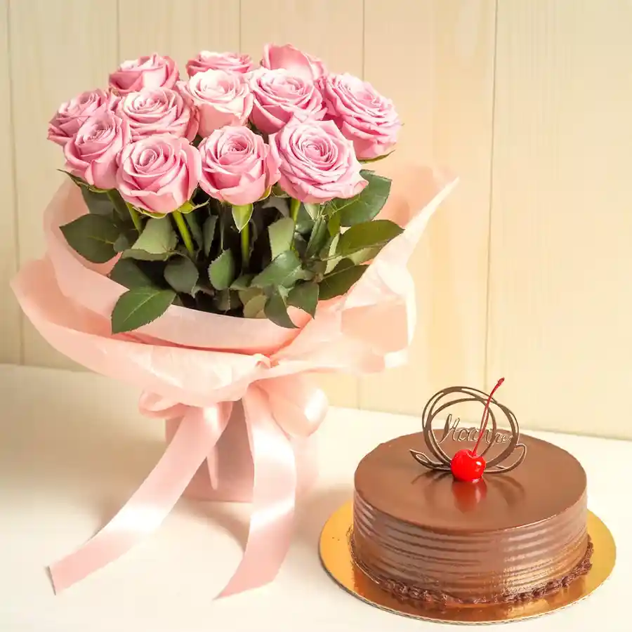A delightful gift featuring a 1/2 kg Chocolate Truffle Cake accompanied by a bouquet of 10 elegant pink roses, perfect for celebrations.