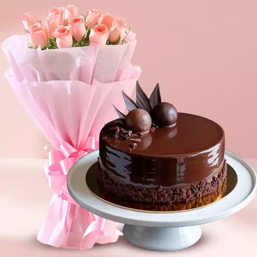 Exquisite 1/2 kg Chocolate Truffle Cake with a bouquet of 10 pink roses for gifting.