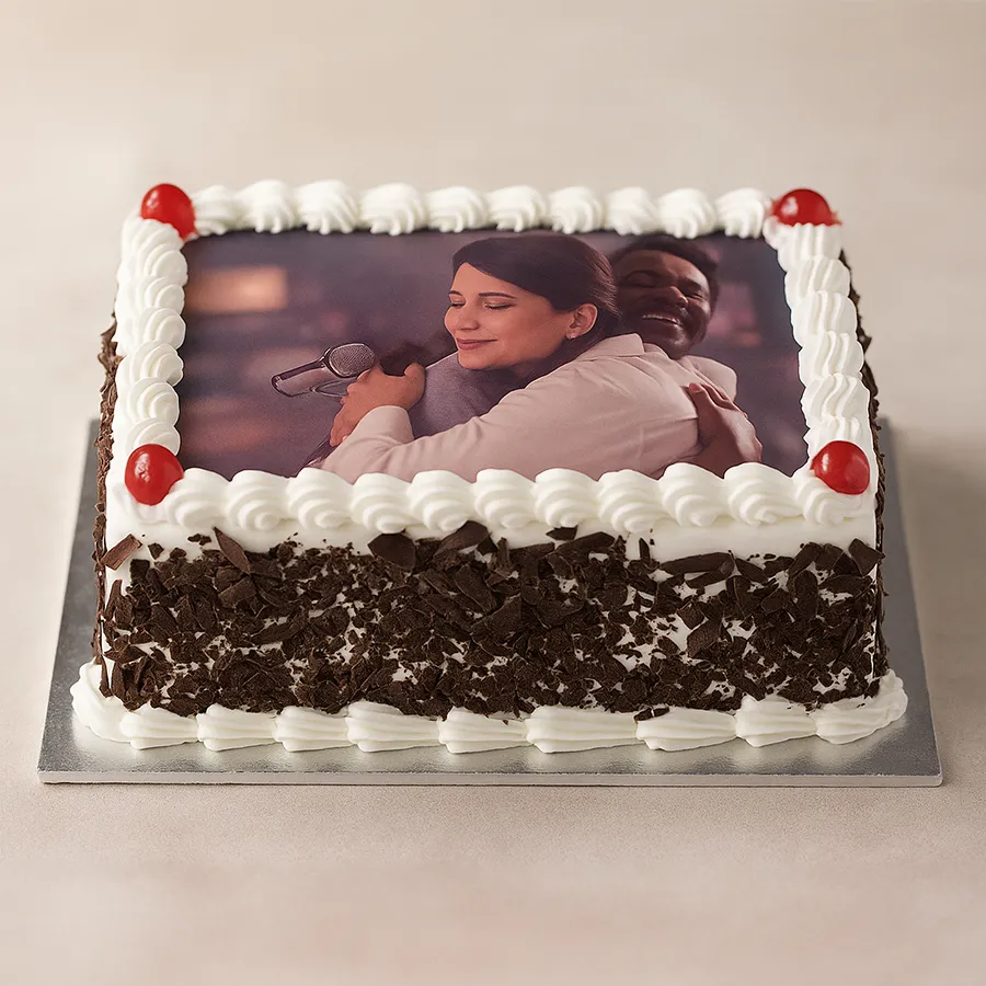 A beautifully designed Black Forest Photo Cake, customized with a photo, perfect for celebrations.
