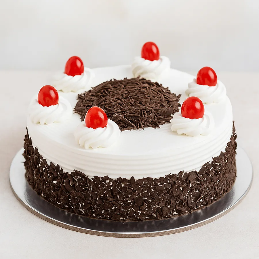 1 Lb Black Forest Cake, adorned with cherries and whipped cream, perfect for birthday celebrations.
