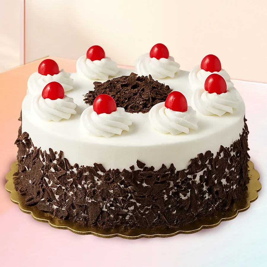 Luxurious Black Forest Cake for anniversary celebration, featuring rich chocolate layers and cherries.