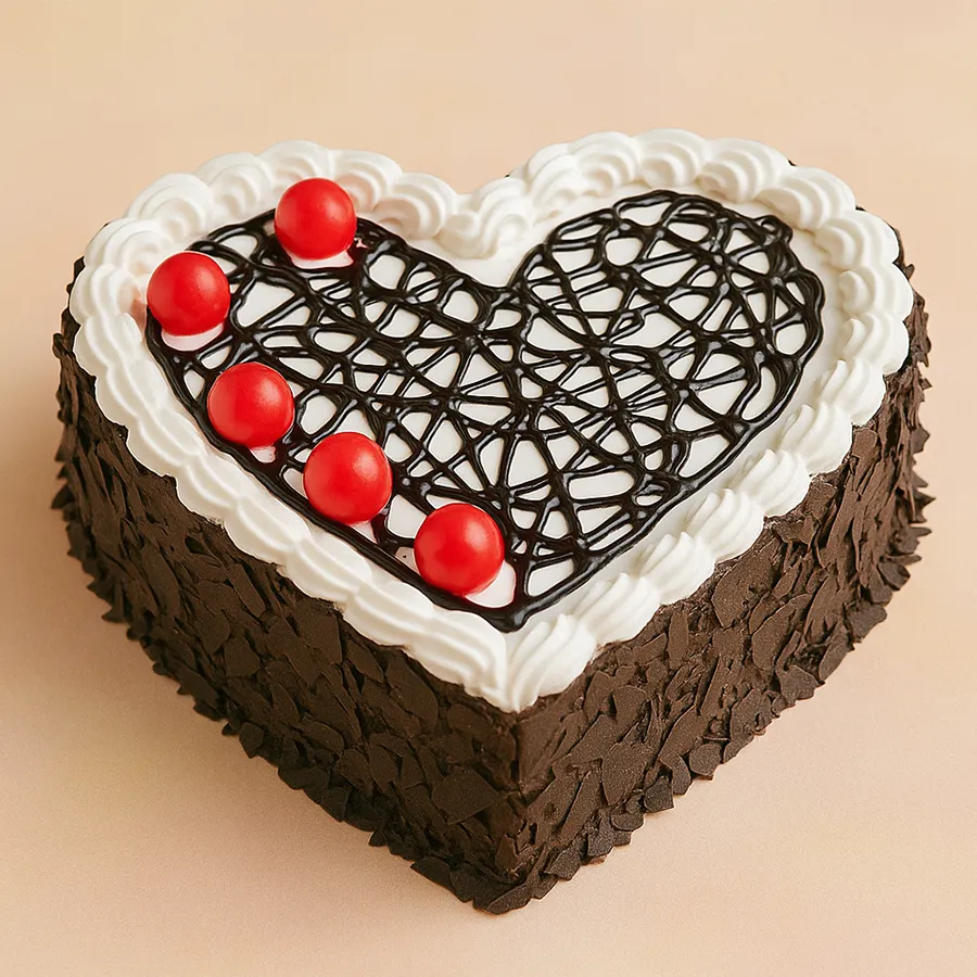 Heart-shaped Black Forest cake, rich in chocolate and cherries, perfect for sharing love and special moments.
