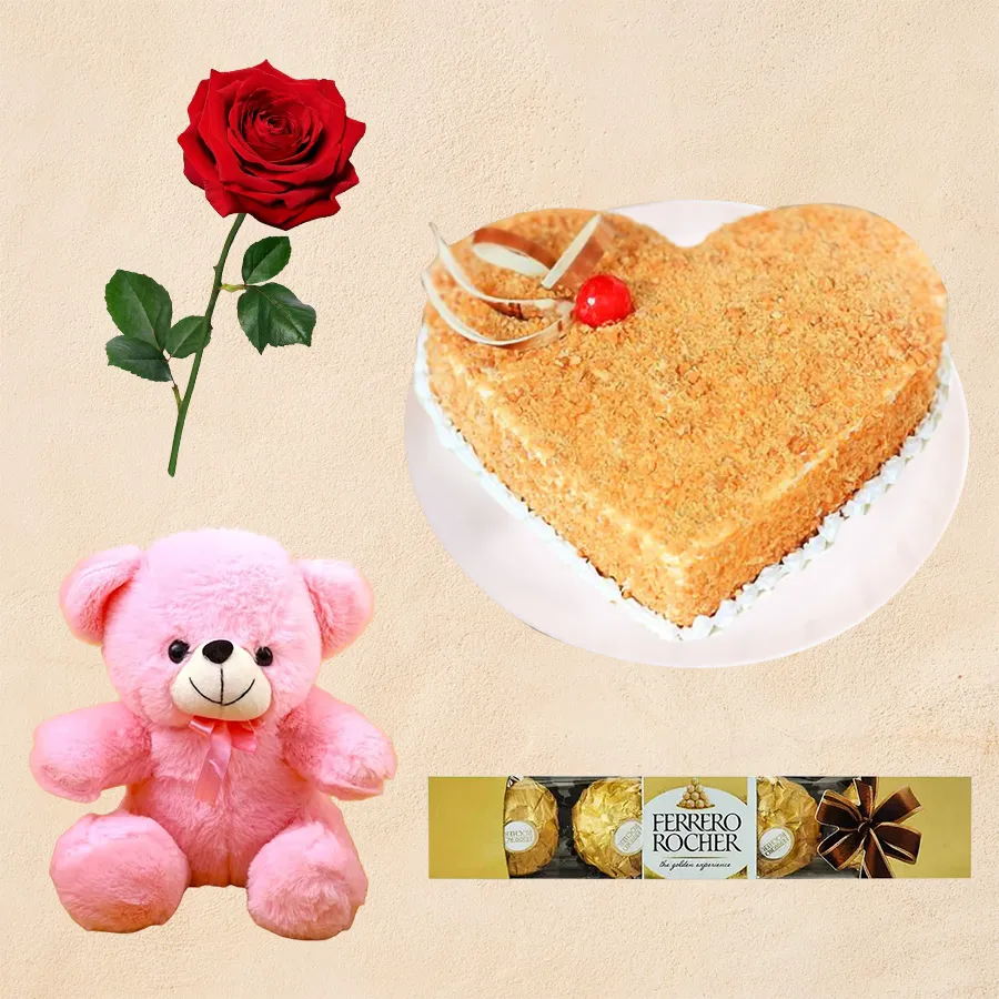 Gift combo featuring a heart-shaped Butter Scotch Cake, red rose, small teddy, and Ferrero Rocher chocolates in an affectionate arrangement.