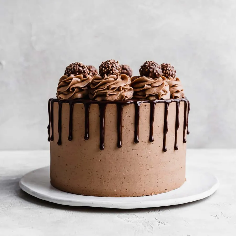 A delicious Ferrero Rocher Chocolate Cake, ideal for gifting, showcasing rich chocolate and hazelnut flavors.