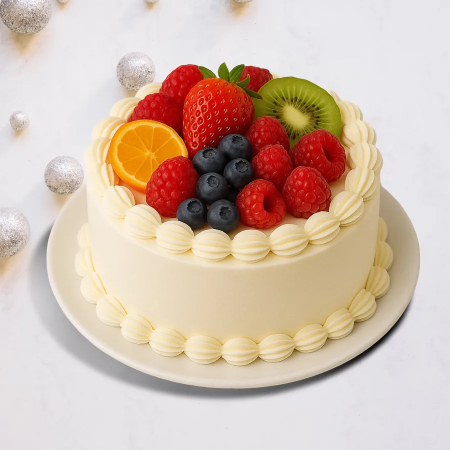 A 1 lb Vanilla Fresh Fruits Cake topped with vibrant fresh fruits, perfect for celebrations and gifting.