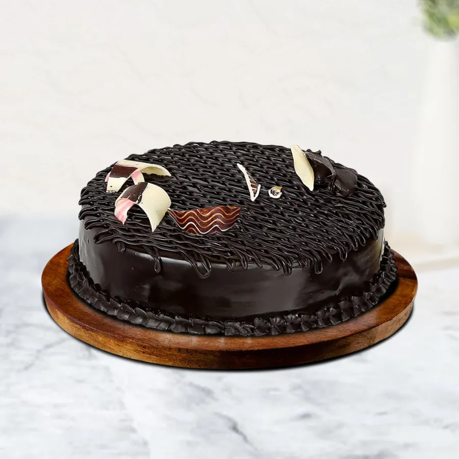 A luscious Rich Choco Fudge Cake, featuring moist chocolate layers and a glossy fudge glaze, ideal for special occasions or personal indulgence.