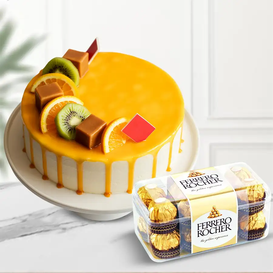 Festive 1 lb Fresh Fruits Cake accompanied by 16 Ferrero Rocher chocolates, ideal for holiday gifting.