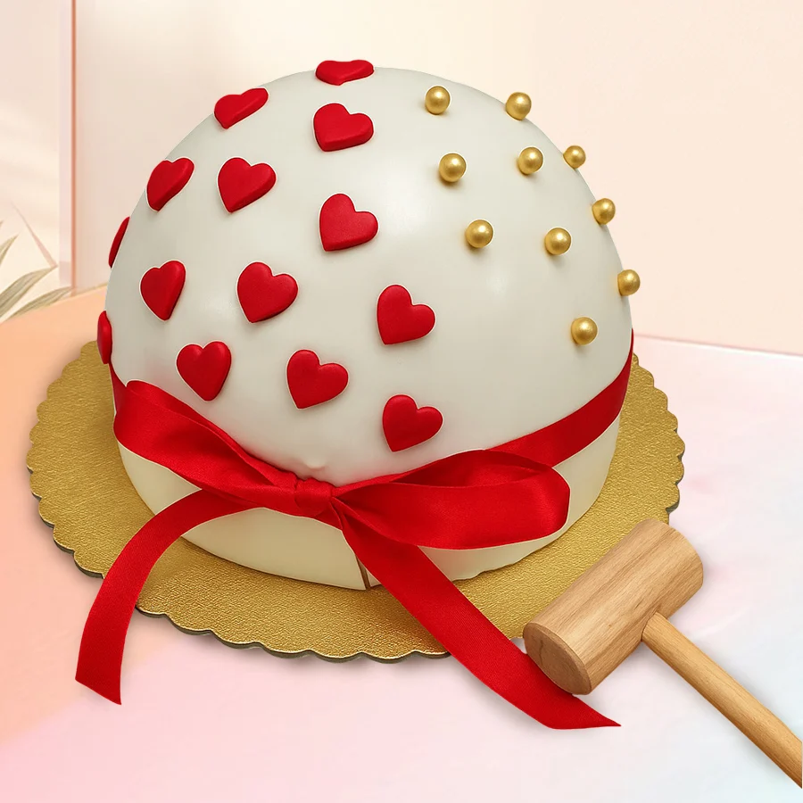 Marvelous Round Smash Cake with a mini hammer for fun celebrations.