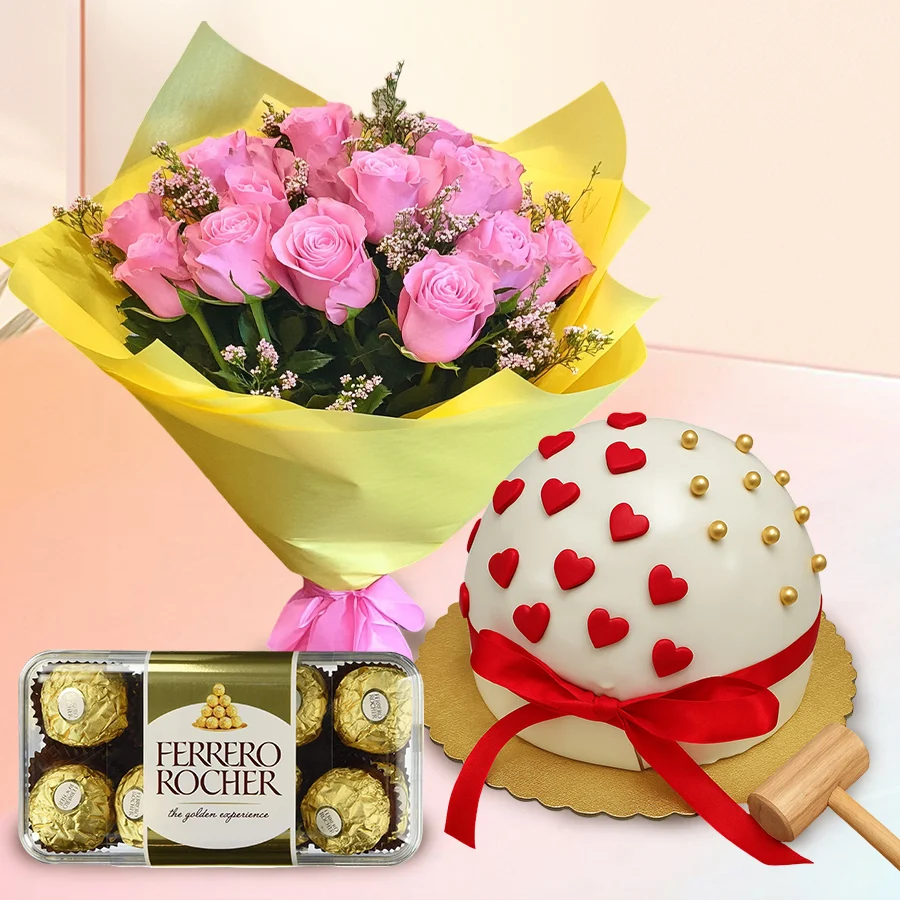 Joyous Pinata Cake Set with pink roses and Ferrero Rocher chocolates, complete with a hammer for celebration.