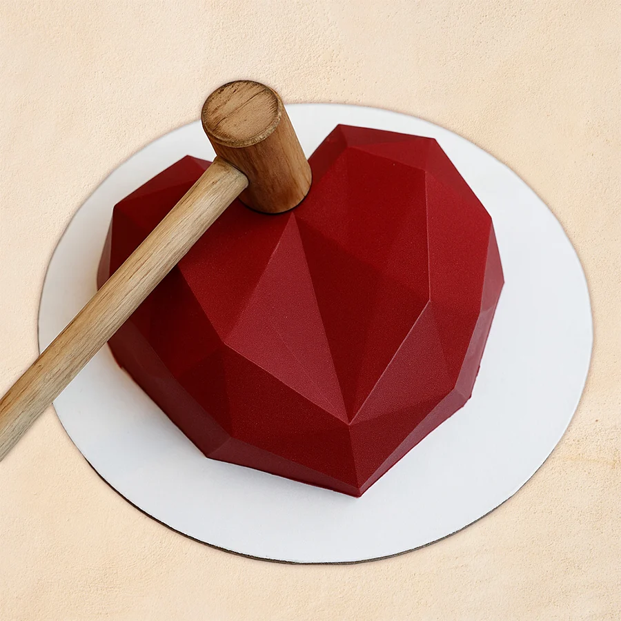 Heart Shape Pinata Cake with Hammer, perfect for heartfelt celebrations.