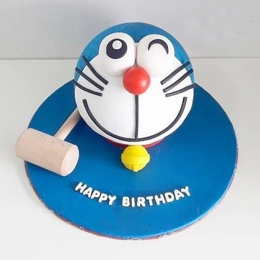 Doremon-themed smash cake with hammer, perfect for celebrations.