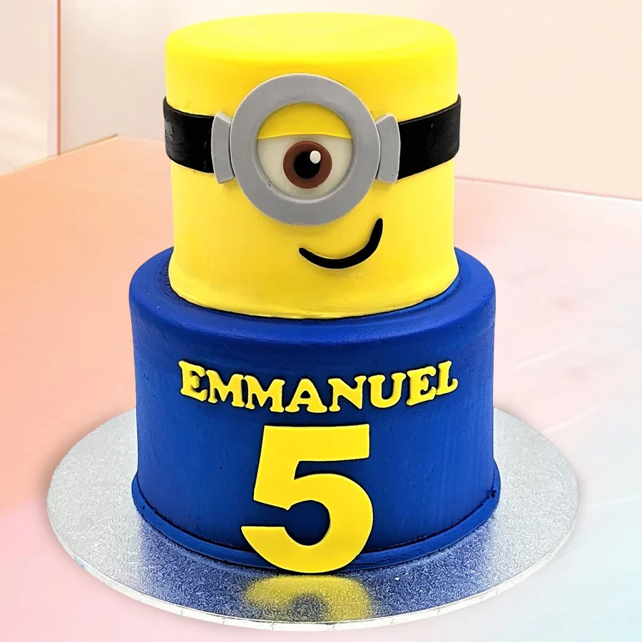 Two-tier Minion birthday cake, ideal for celebrations, weighing 1.5 kg.