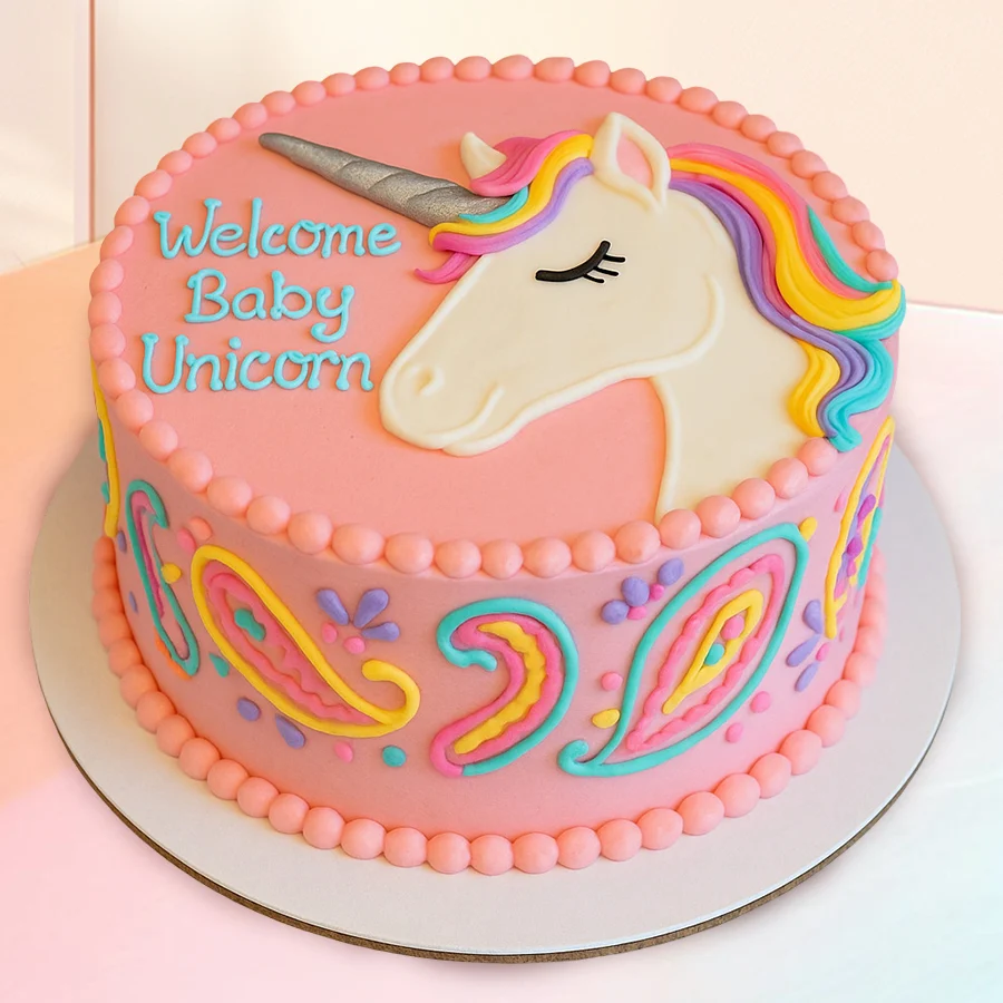 A beautifully decorated 1 lb Unicorn Cake showcasing layers of moist cake and creamy frosting, perfect for celebrations.