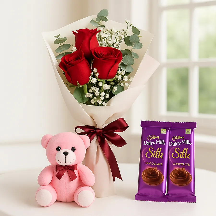 Gift combo featuring a teddy bear, red roses, and chocolates.
