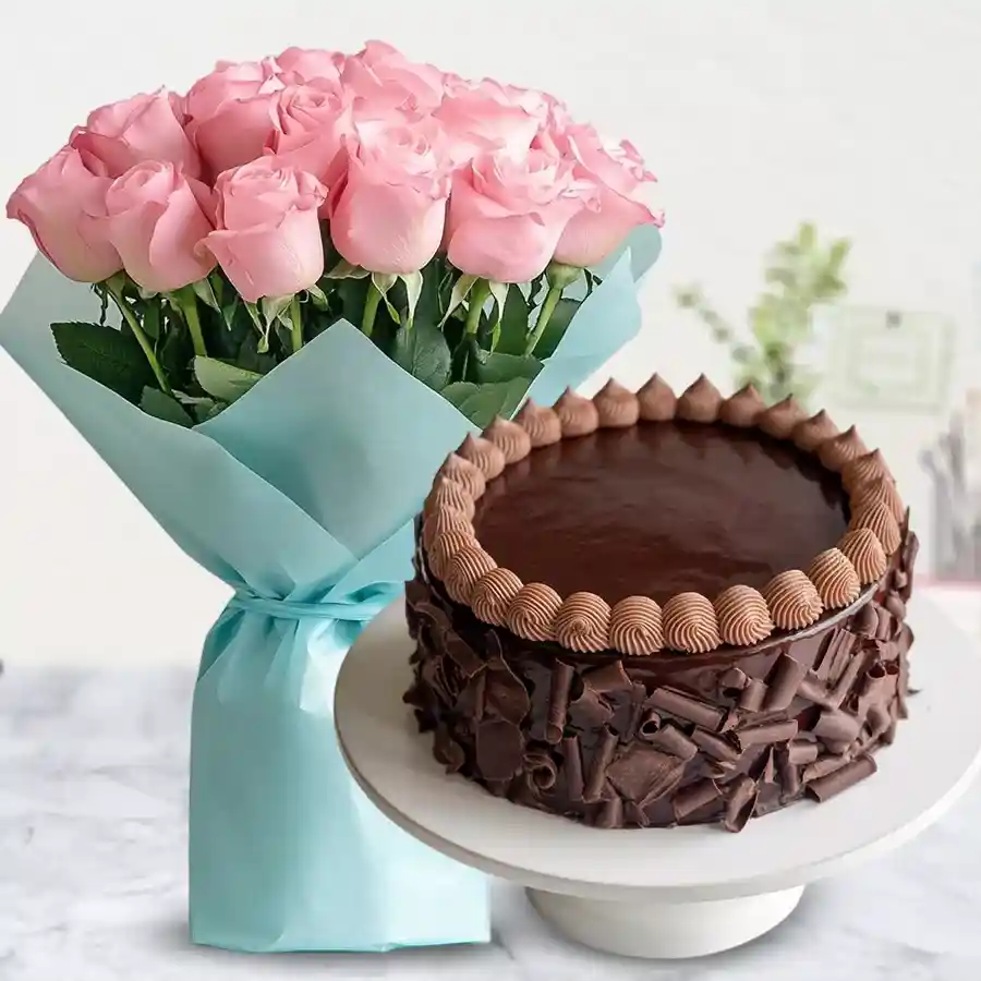 A bouquet of 12 pink roses alongside a rich 1/2 kg chocolate cake, a perfect Mother's Day gift.