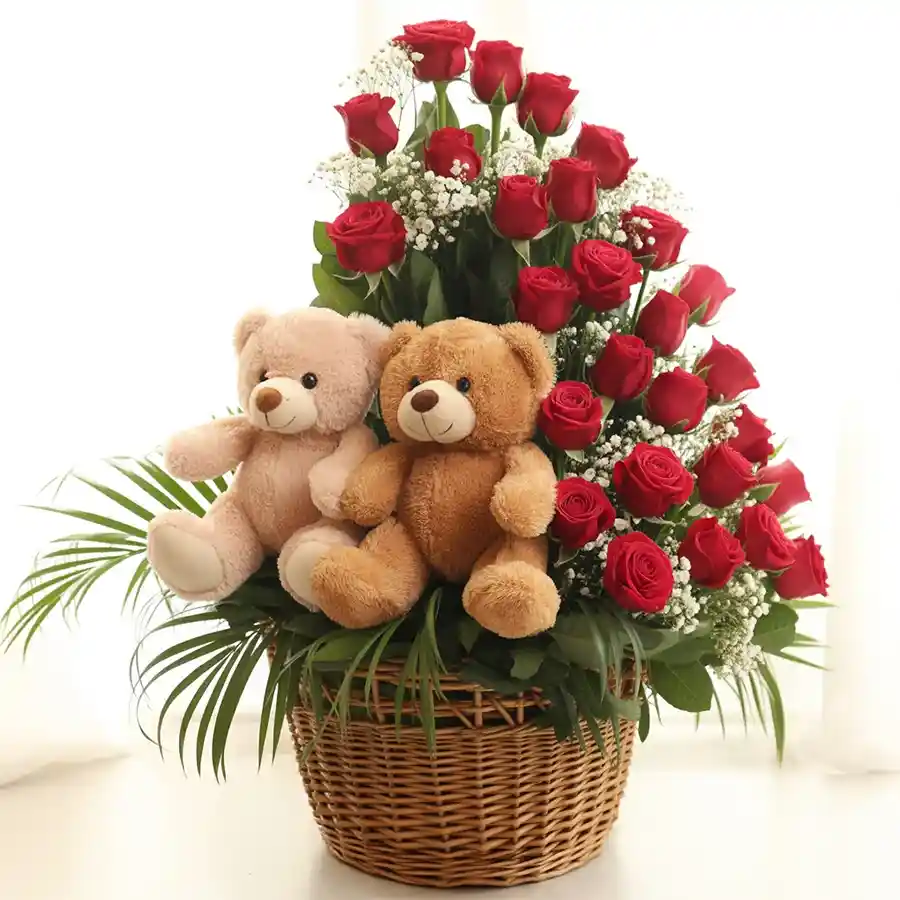 Beautiful arrangement of 15 red roses with twin teddy bears, perfect for gifting.