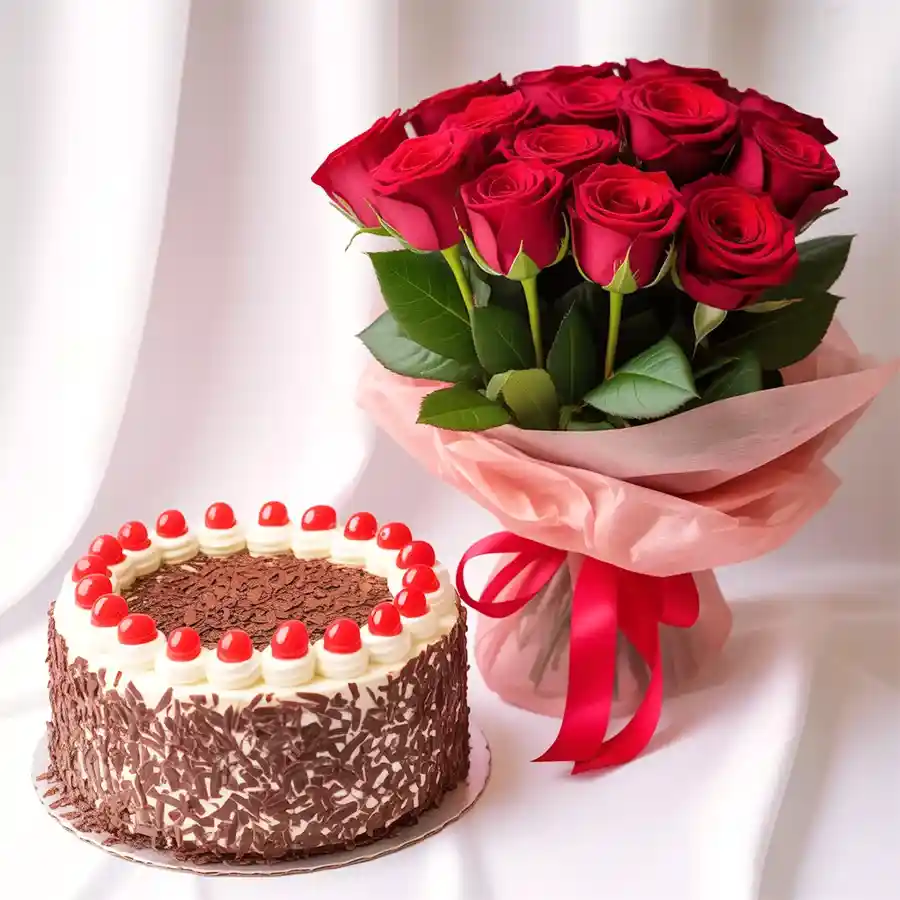 A romantic anniversary combo featuring a 2.2 lb Black Forest cake and a bouquet of ten red roses, symbolizing love and celebration.