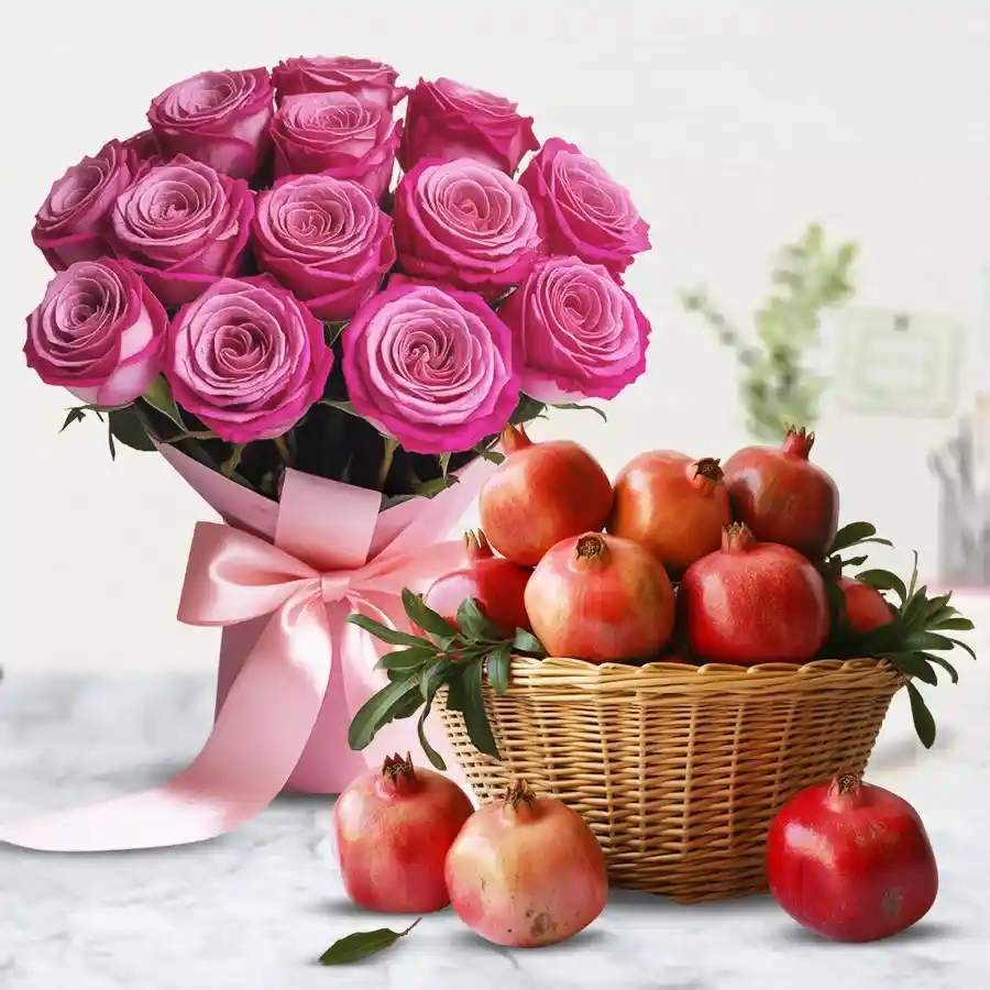 Bouquets of aromatic pink roses and a basket of juicy pomegranates.