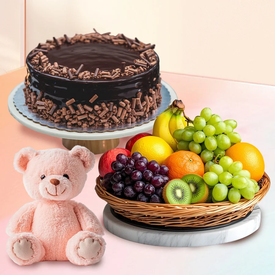 Heartwarming gift combo featuring fresh fruits, a teddy bear, candles, and a chocolate cake.