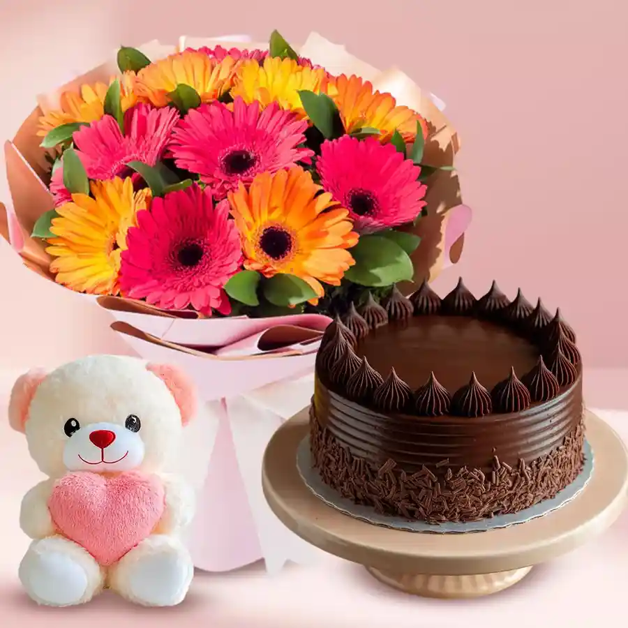 Midnight surprise gift featuring chocolate cake, gerberas bouquet, and small teddy bear.