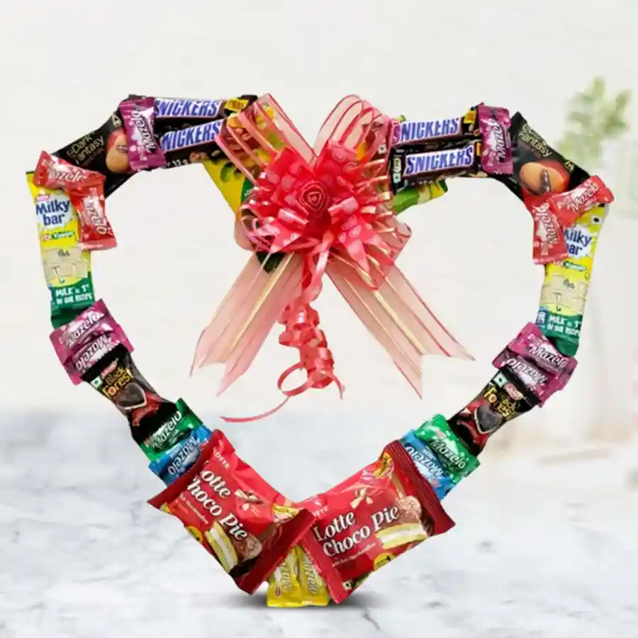 Special Chocolate Heart Wreath filled with assorted chocolates including Snickers, KitKat, Dark Fantasy, Chocopie, Livian Black Forest, Mazelo Candies, and Candyman Kuchha Aam Jellies