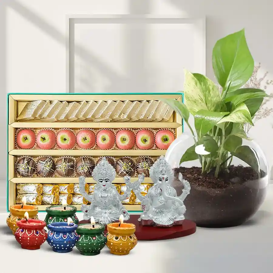 Prosperity Diwali Blessings Hamper with Money Plant, sweets, idol, and diyas.
