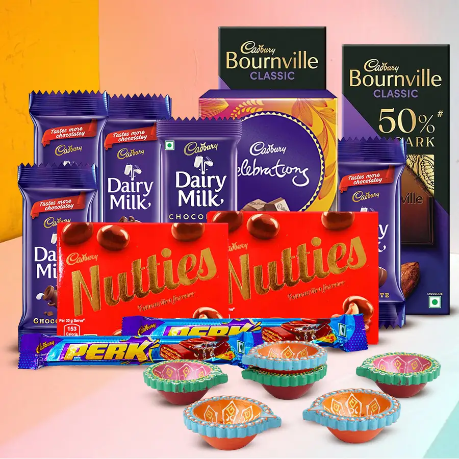 Divine Diwali Chocolate Indulgence Hamper with assorted Cadbury chocolates and mud diyas for an enchanting celebration.