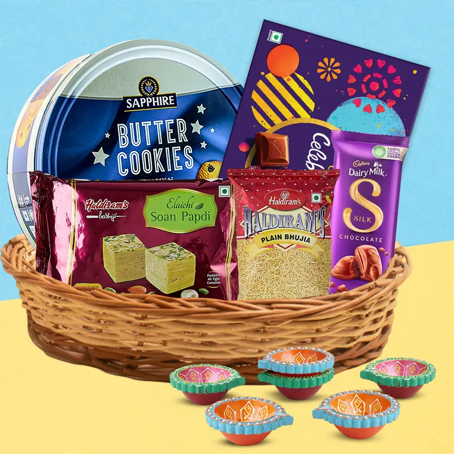 Diwali Treasure Treats Gift Hamper featuring chocolates, sweets, snacks, and decorative items for celebration.