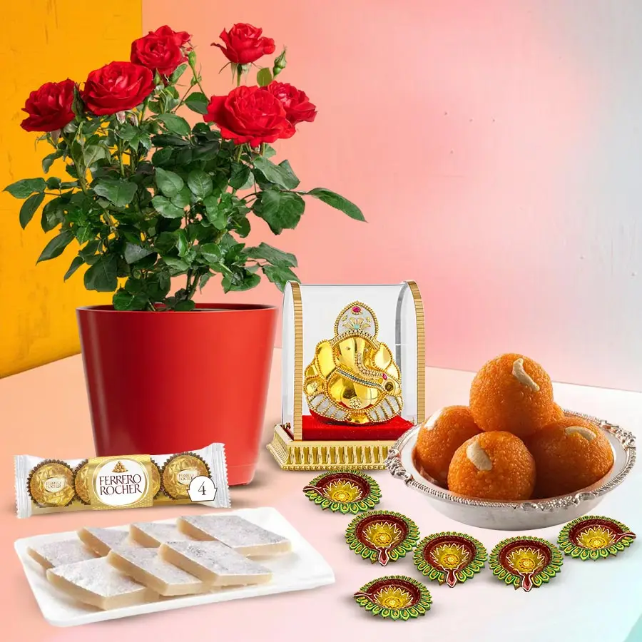 Eco Charm Diwali Gift Set featuring a rose plant, Ganesh idol, chocolates, sweets, and diyas for festive celebrations.