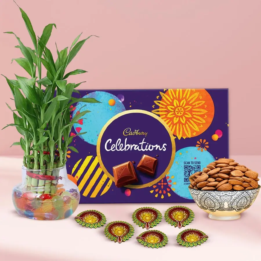 Eco-Friendly Diwali Gift Set featuring a lucky bamboo plant, chocolates, almonds, and mud diyas.