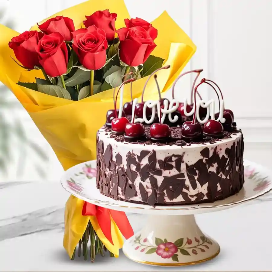 A delightful combination of a personalized Black Forest cake and a hand bunch of red roses.