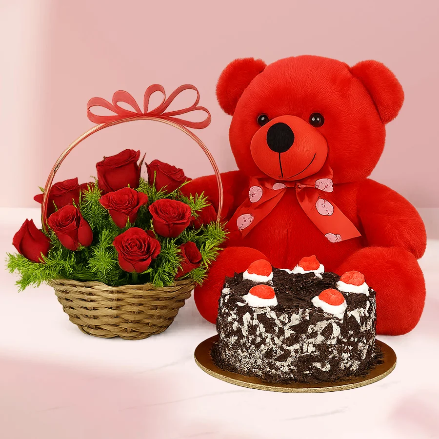 Romantic Rose Delight with red roses, a round Black Forest cake, and a 12-inch red teddy bear in a basket.