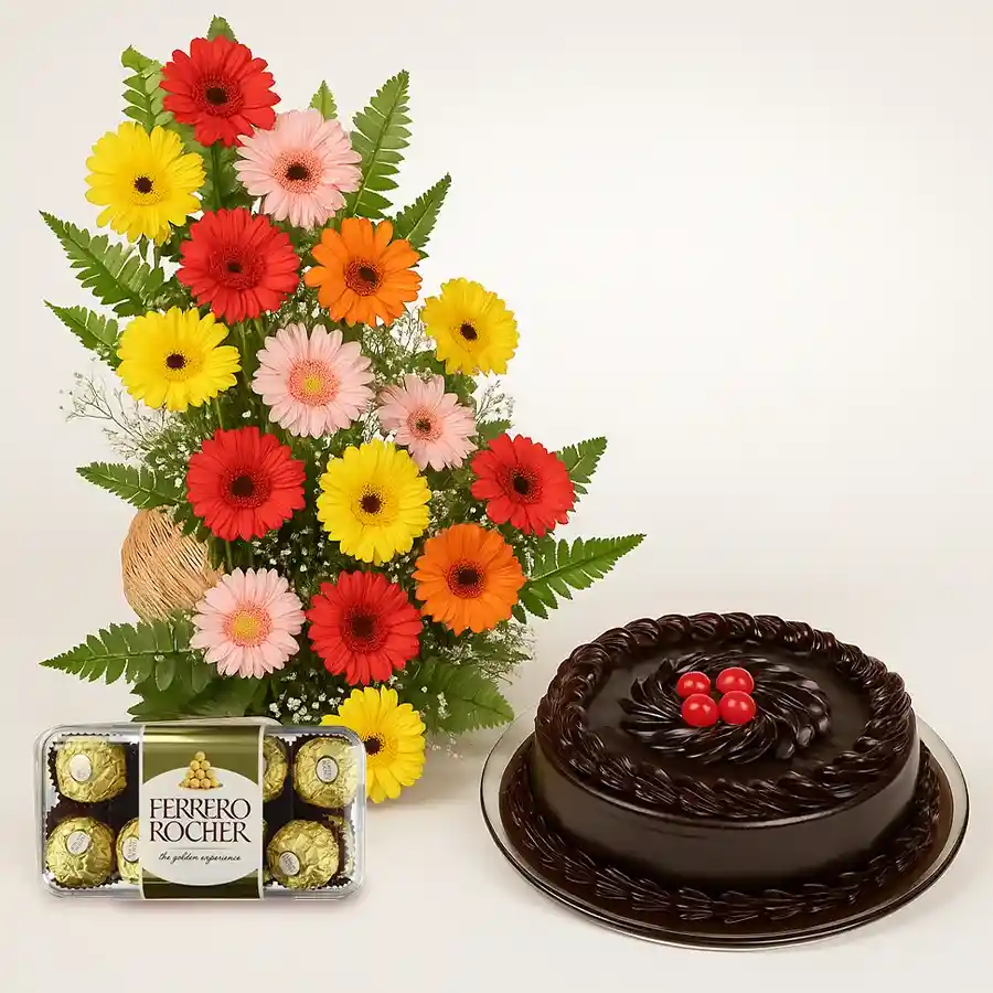 Colorful gerberas in a basket with chocolate cake and Ferrero Rocher chocolates.