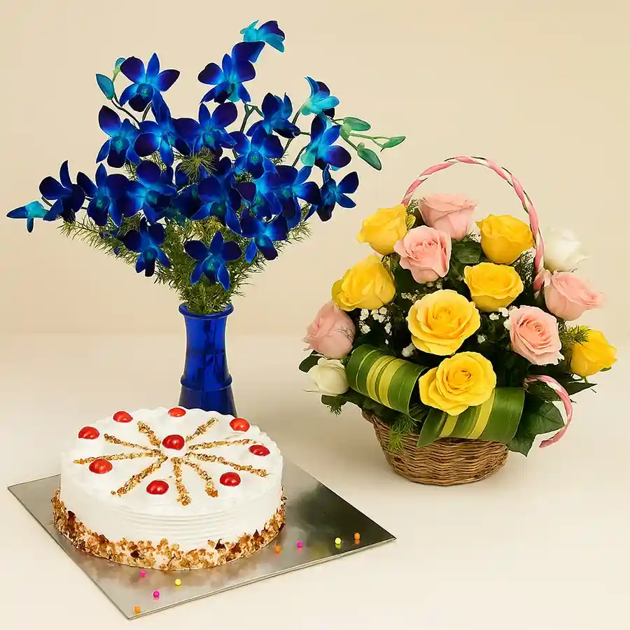 A beautiful arrangement of blue orchids in a vase, alongside a basket of mixed roses and a round butterscotch cake.