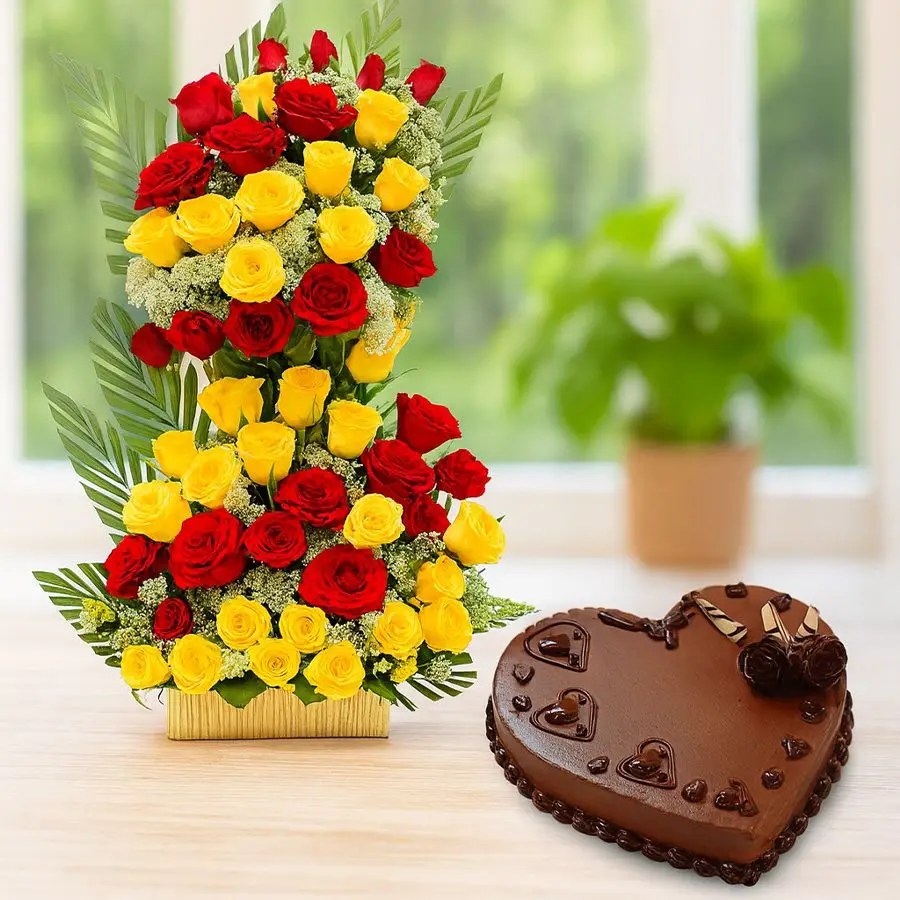 Heartfelt combo featuring 50 mixed roses and a heart-shaped chocolate cake in a decorative basket.