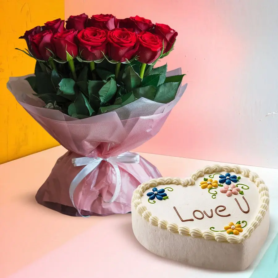 Heart-shaped vanilla cake with "Love You" atop and a bunch of 12 red roses with green leaves.