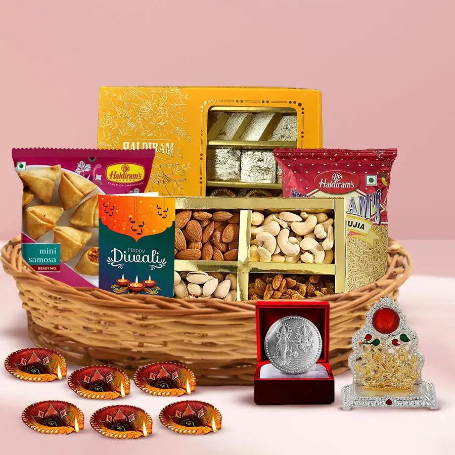 Divine Diwali Treats Gift Basket featuring assorted sweets, snacks, and decorative items for festive celebrations.