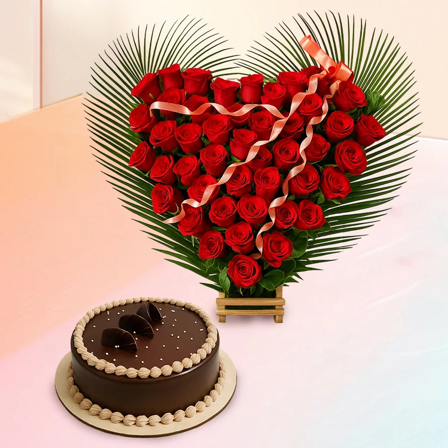 Heart-shaped bouquet of 50 red roses alongside a 1kg eggless chocolate truffle cake.