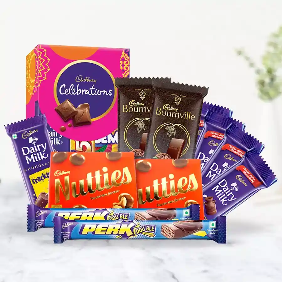 An inviting Cadbury Delight Chocolate Gift Basket filled with various chocolates, including Nutties, Bournville, and Dairy Milk, perfect for gifting.
