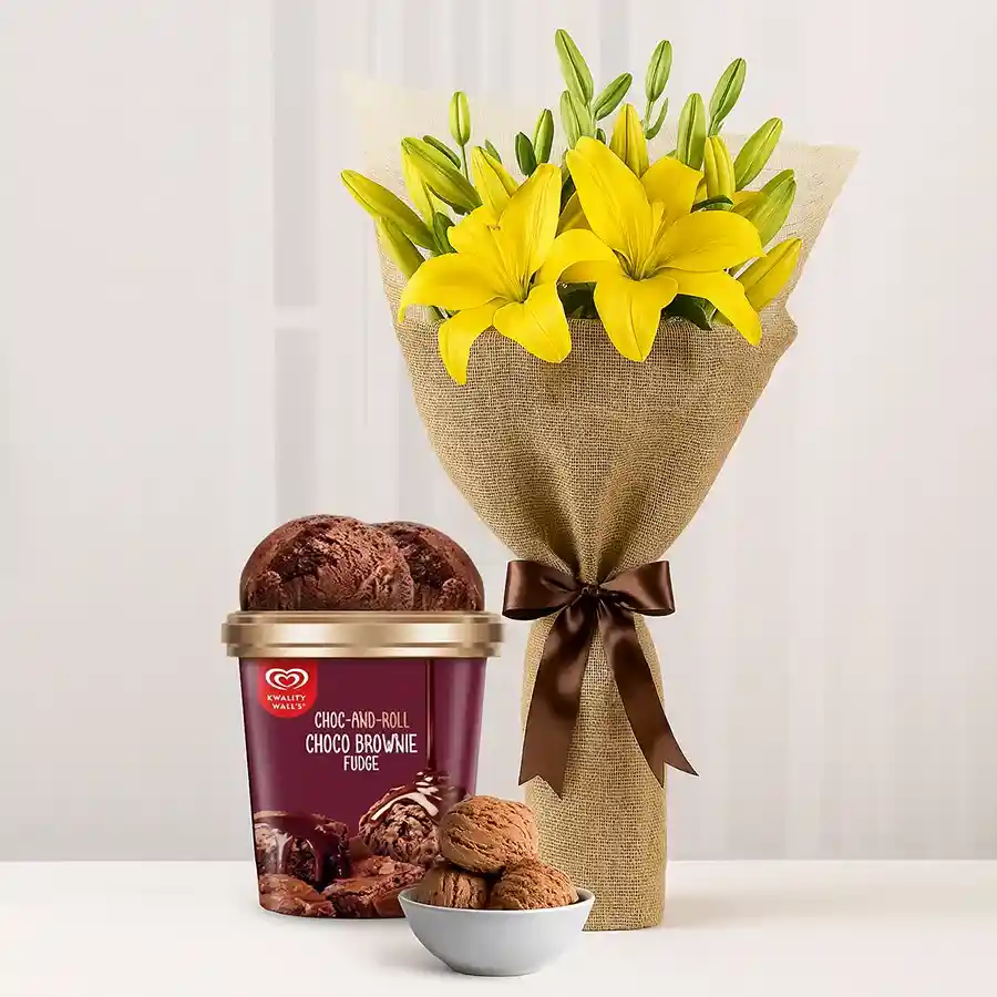 Bright yellow lilies bouquet paired with Kwality Walls Choco Brownie Fudge Ice Cream.
