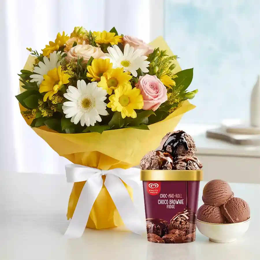 Exotic mixed flower arrangement with chocolate brownie fudge ice cream for Mother's Day.